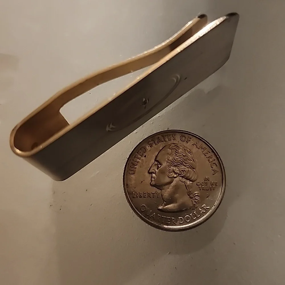 Goldtone  Money Clip With A Diamond Like Stone.
